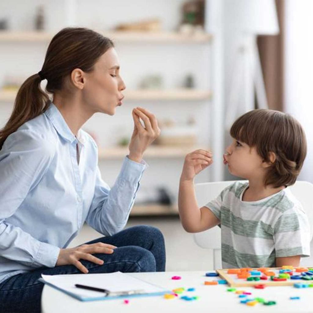 A neurodivergent child engaging with sensory tools during a comfortable dental visit in San Diego.